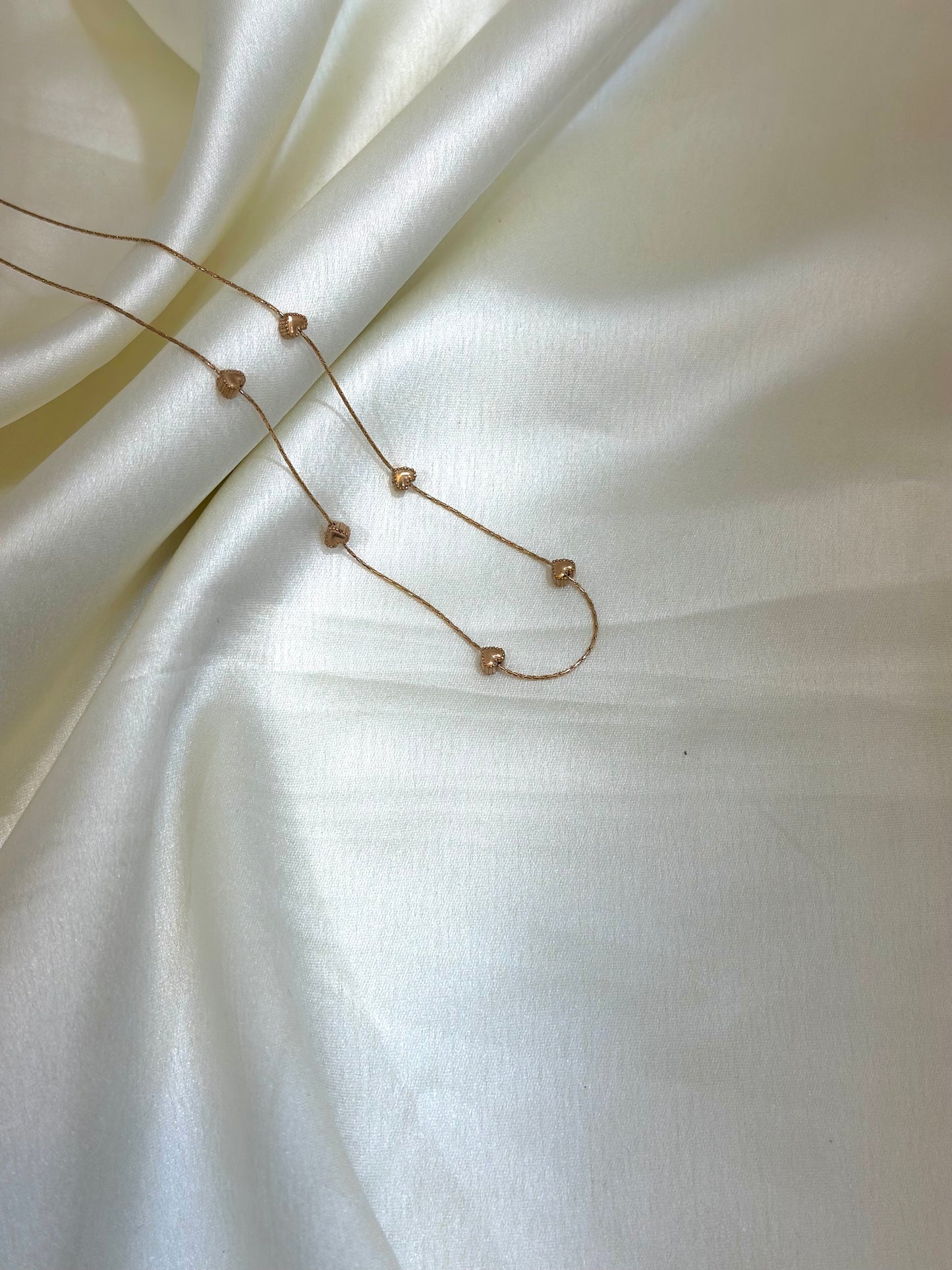 Miral multi-charm heart necklace